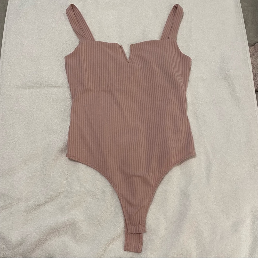 Pink body suit